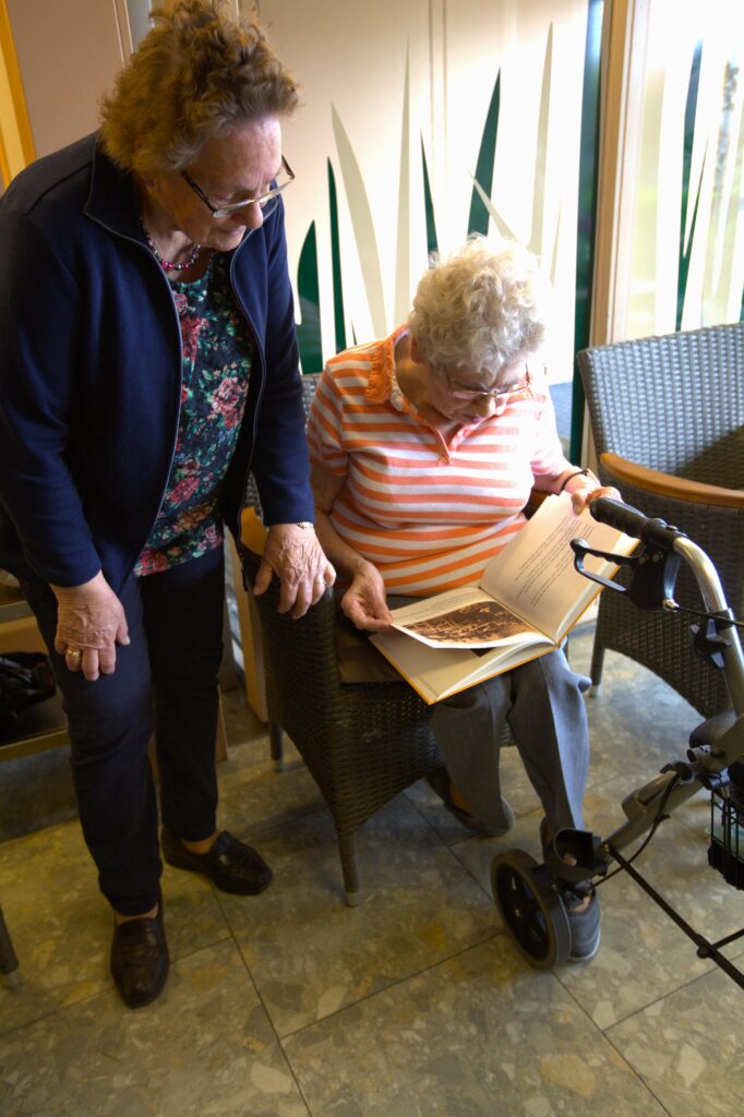 Two of the women behind Everdina's creation holding their book for the first time— a new story, their own story, now published.